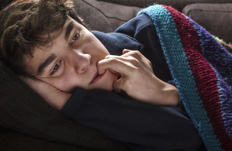 Young man in blanket
