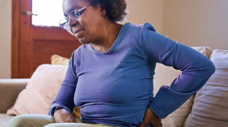 A woman has her hand on her hip.