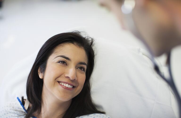 Patient smiling at doctor in hospital