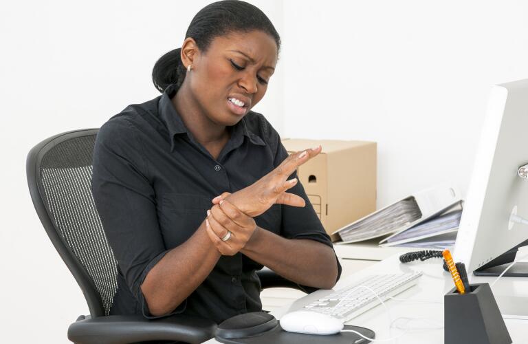 Woman working with wrist pain