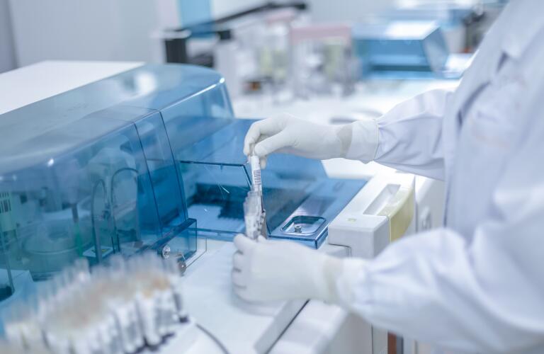 hands of researcher in medical lab