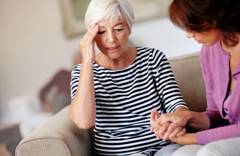 daughter helping ill mother