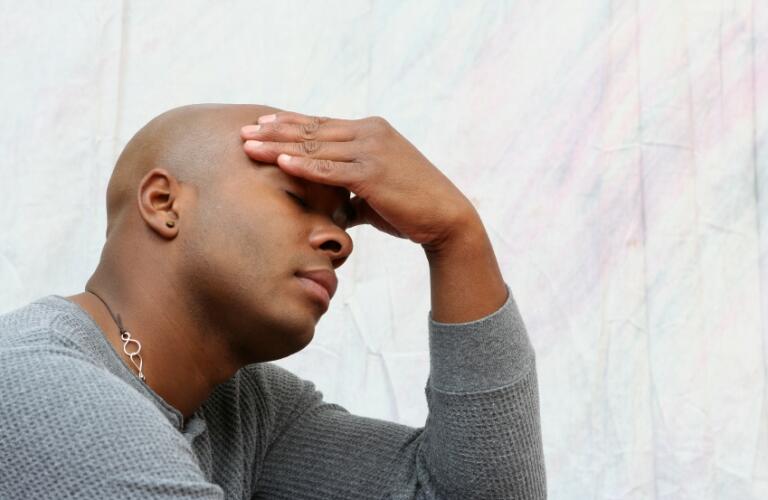 Man holding head - headache