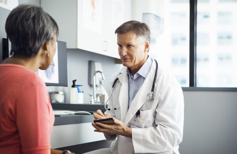 Doctor consulting with patient