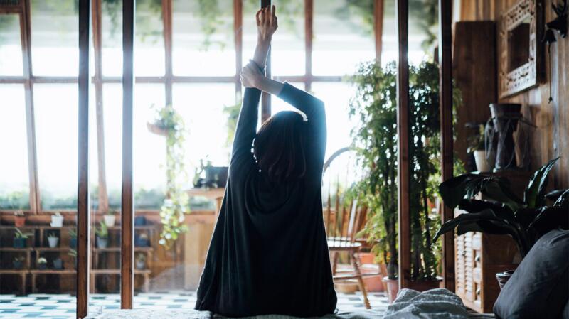 woman stretching arm