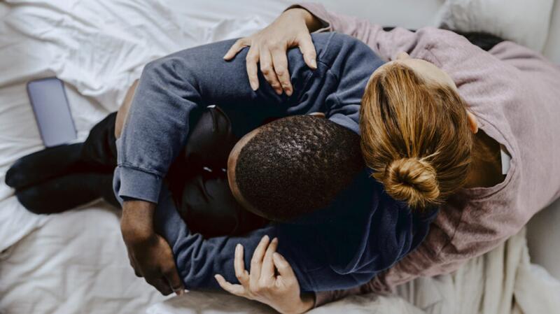 Two people are hugging.