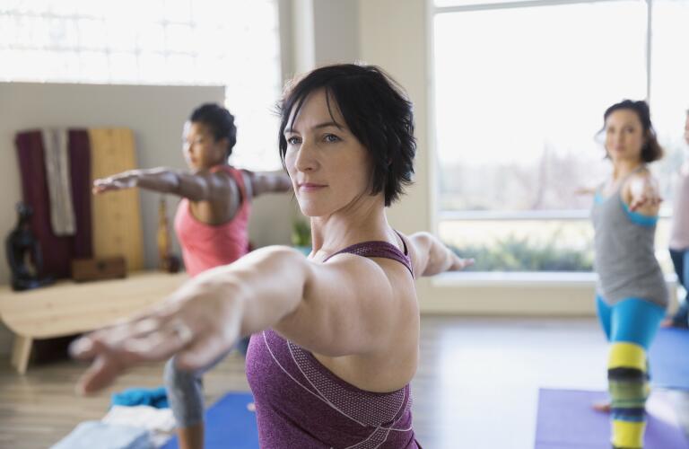 Woman in Warrior Yoga Pose