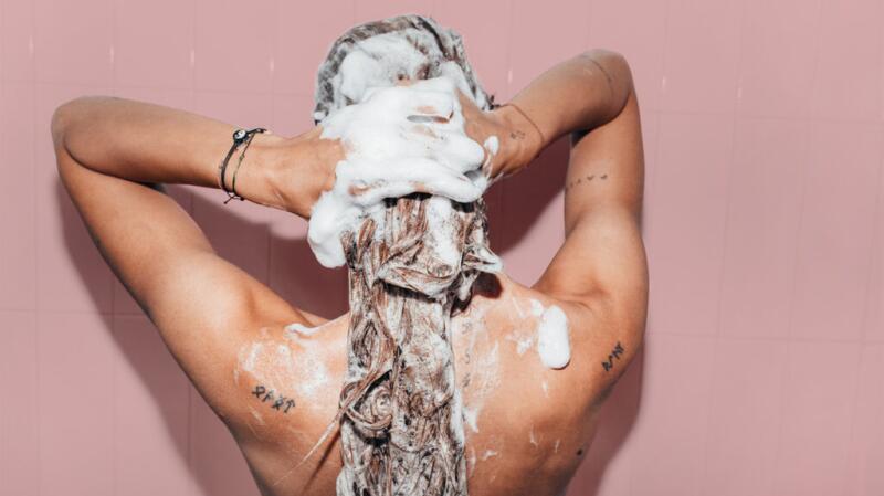 A person washing their hair