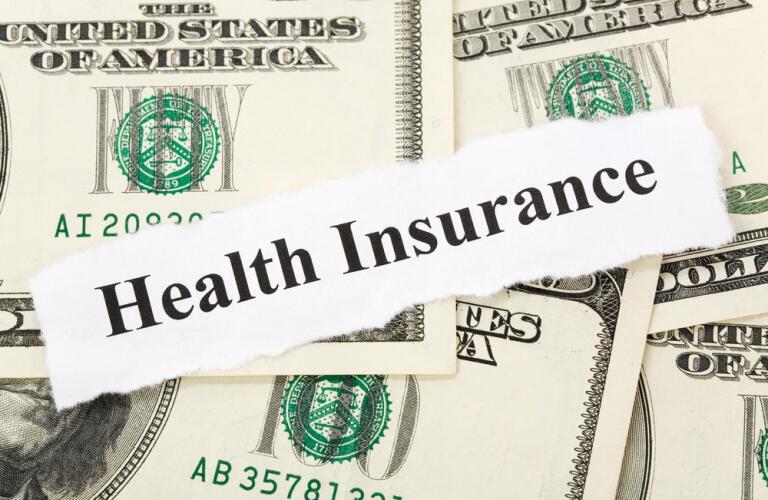 Money with Health Insurance Stamp