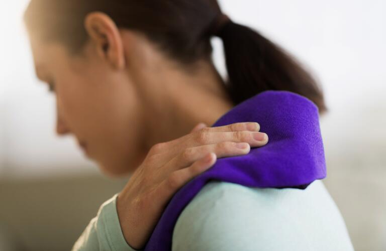 woman icing shoulder