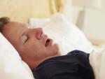 Overweight Man Asleep In Bed Snoring