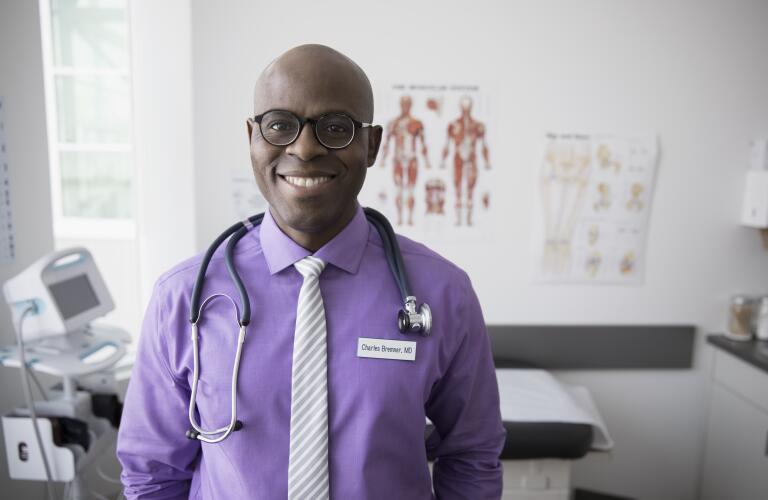 portrait of smiling doctor in office