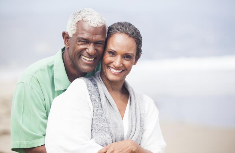 couple-on-beach-smiling
