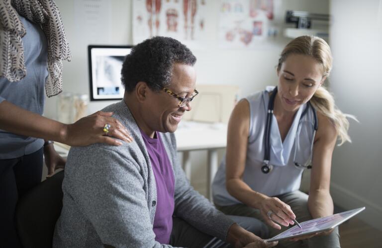 male patient talking with doctor at appointment