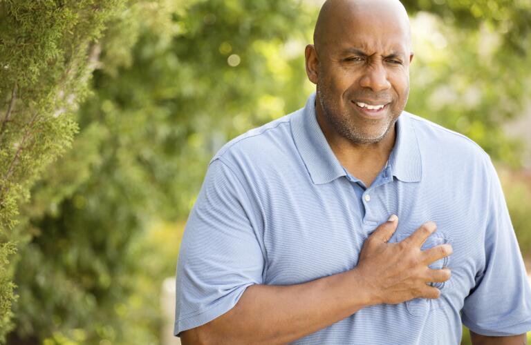 man-outside-experiencing-chest-pain