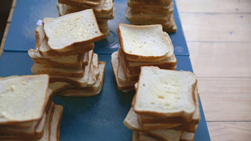 There are slices of bread on a table.