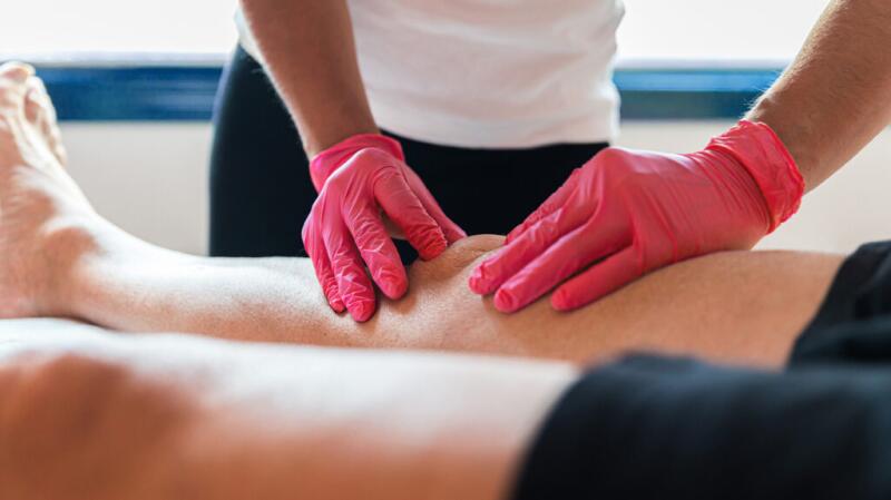 A person gets a knee massage