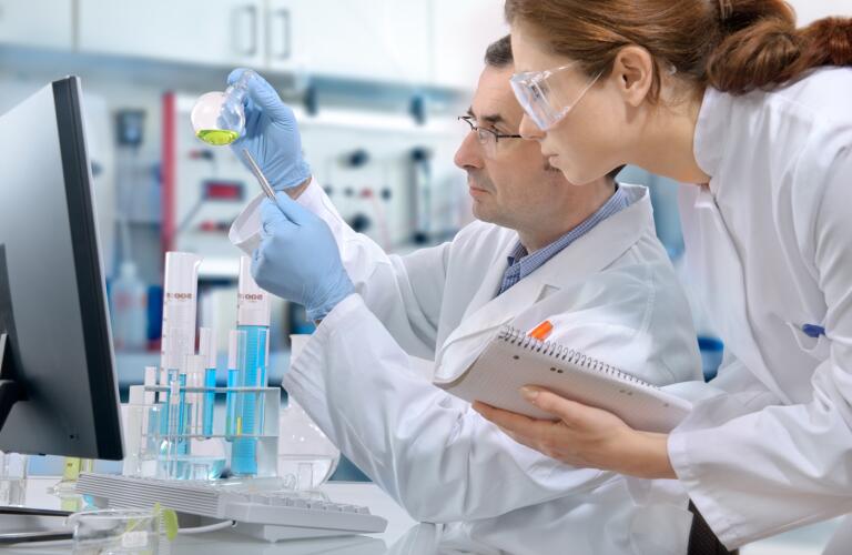 two-people-in-laboratory-looking-at-samples