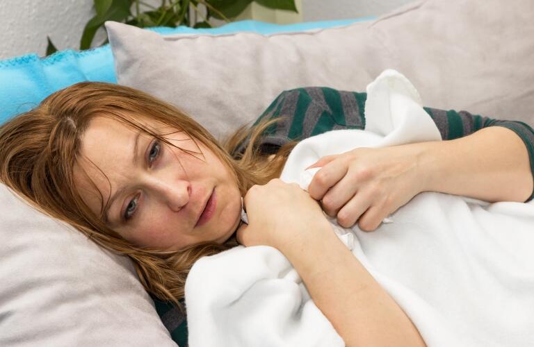 sweating woman on couch