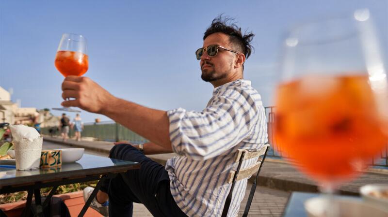 A man drinking alcohol