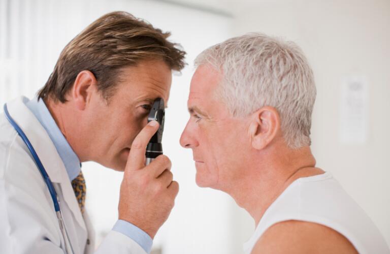 Doctor examining patients eyes