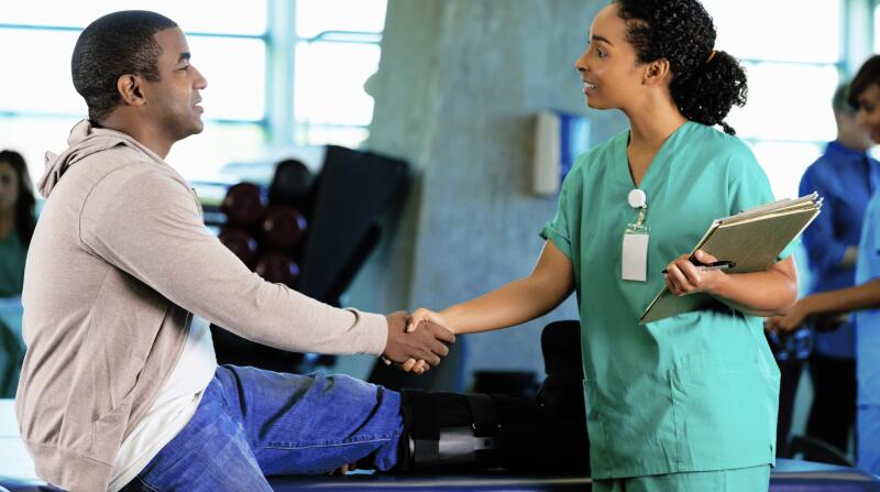 male shaking therapist's hand