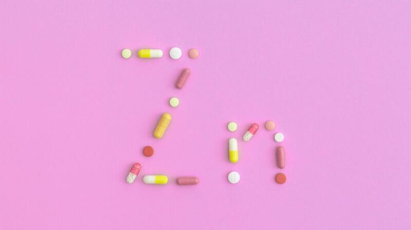 A picture of pills spelling out the zinc element symbol
