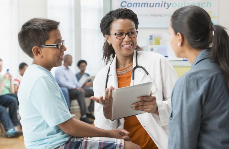 doctor-speaking-with-mother-and-child