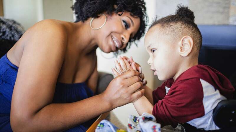 Mother and young child playing together