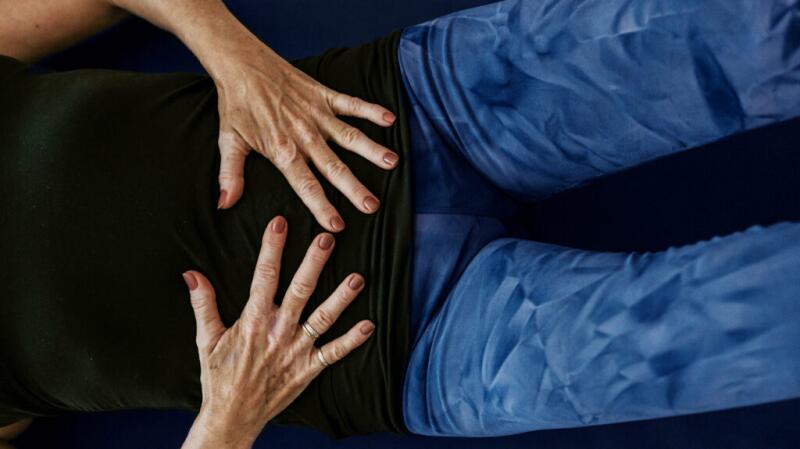 Female's hands on her stomach