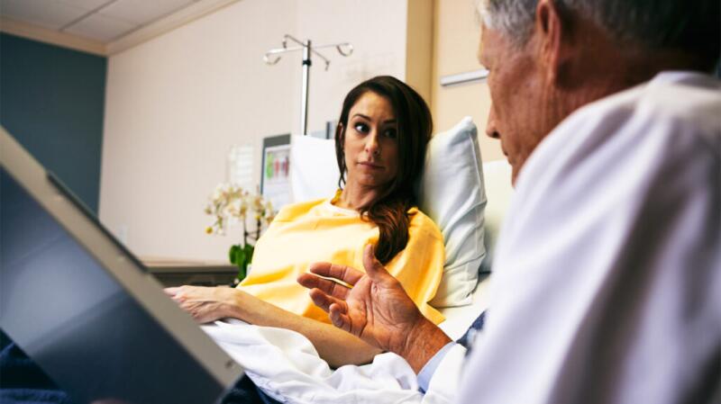a doctor is talking to a woman with ehlers danlos syndrome