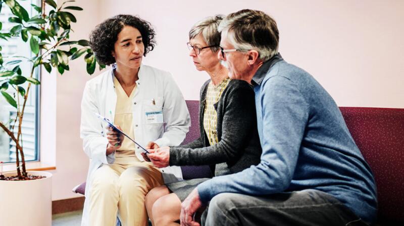 a couple is talking to a doctor