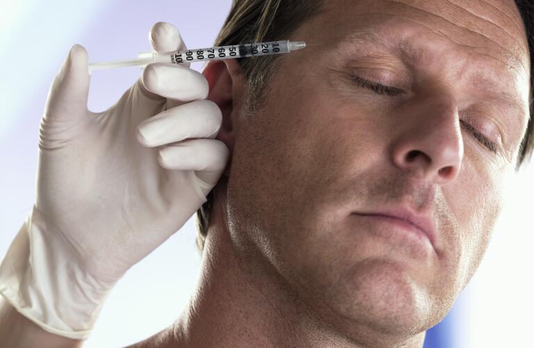 Mature Man Receiving Injection in Forehead