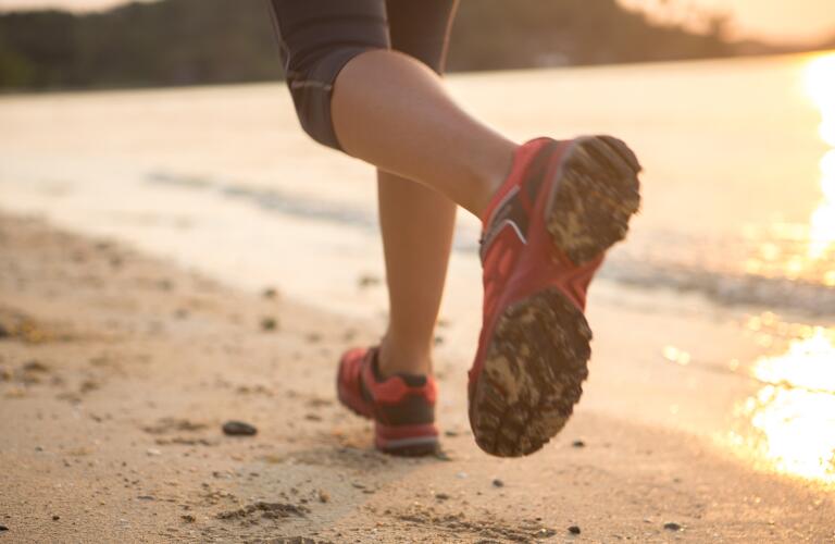 Running on the beach at sunset