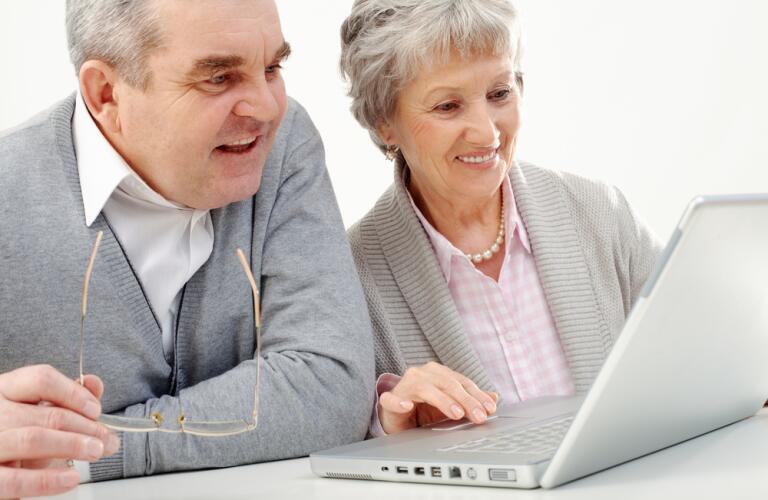 Older couple using laptop