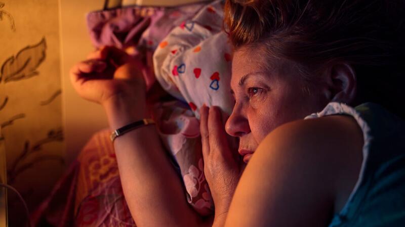 Older woman resting on her side