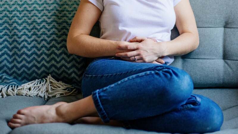 a person with ulcerative proctitis is experiencing stomach cramps