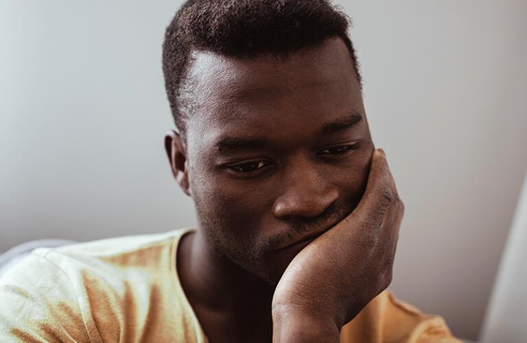 Close-up of worried man at home