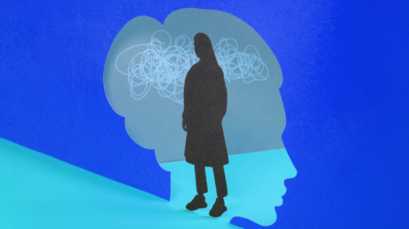 Illustration showing a silhouette of a female's head with confusion lines and a shadow over the top of it, against a blue background