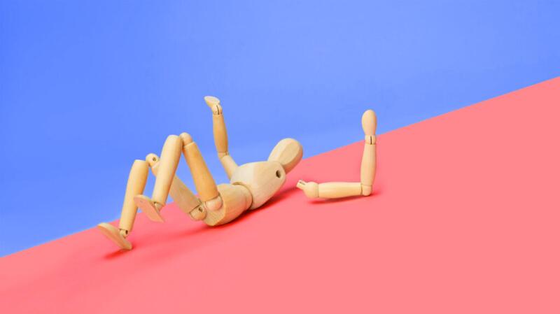 A figure with a broken arm
