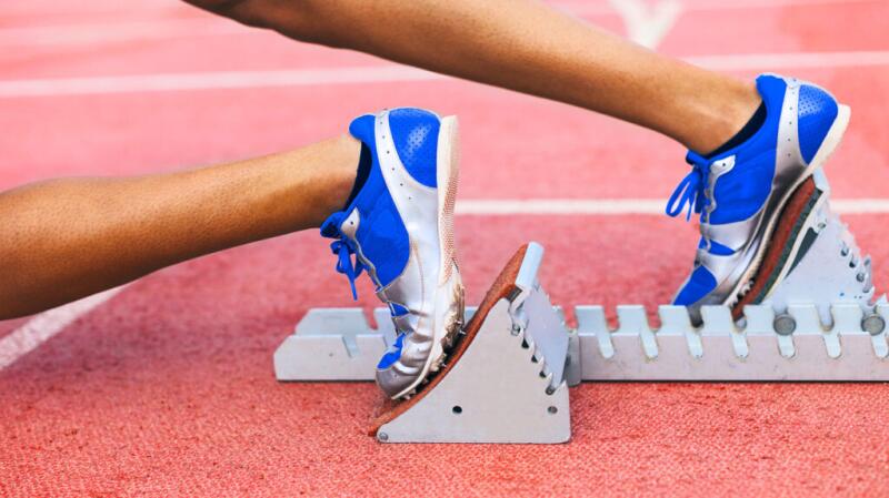 A closeup of a person's feet in running shoes