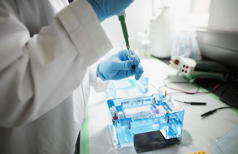 scientist-with-pipette-in-laboratory