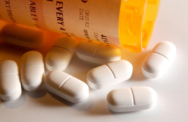 Prescription-Pain-Pills-spilling-out-of-a-bottle