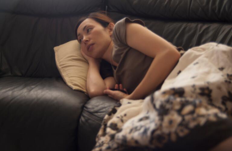Woman Resting on Sofa
