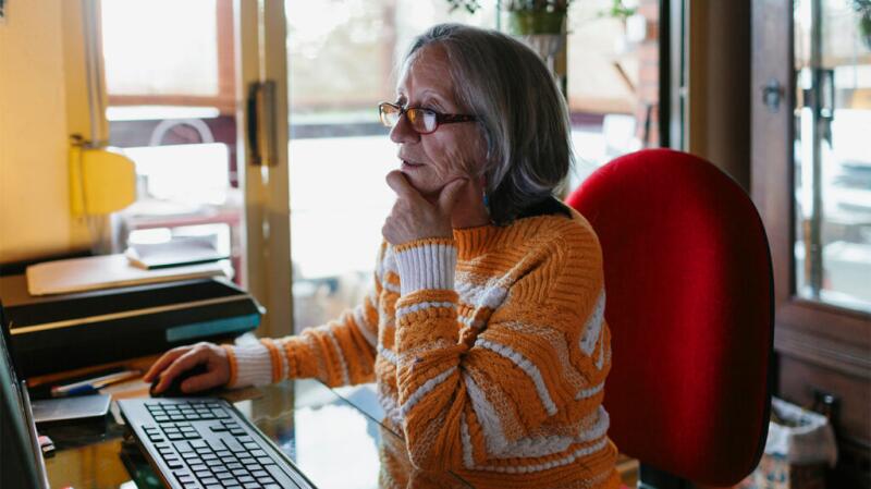 a woman is researching gangrene on a laptop