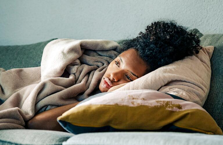 tired-fatigue-black-woman-lying-on-sofa-thumbnail.jpg