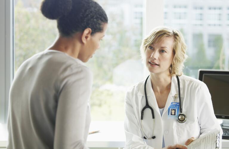 woman seeking treatment from female doctor