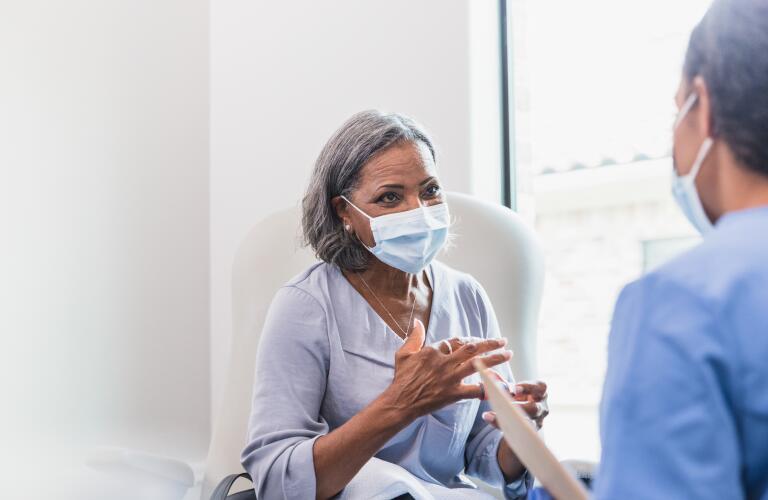 senior adult patient talks with doctor