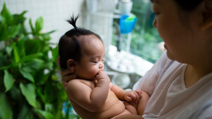 A parent holds their child