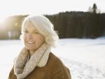 Portrait of smiling mature woman in snow